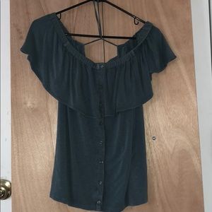 a blue-ish green off the shoulder shirt